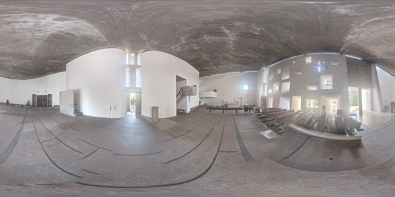Nave of the Ronchamp chapel with its wall of light