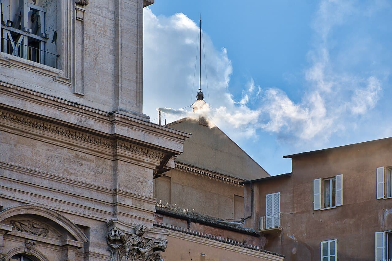 White smoke rising from the chimney of the Sistine Chapel