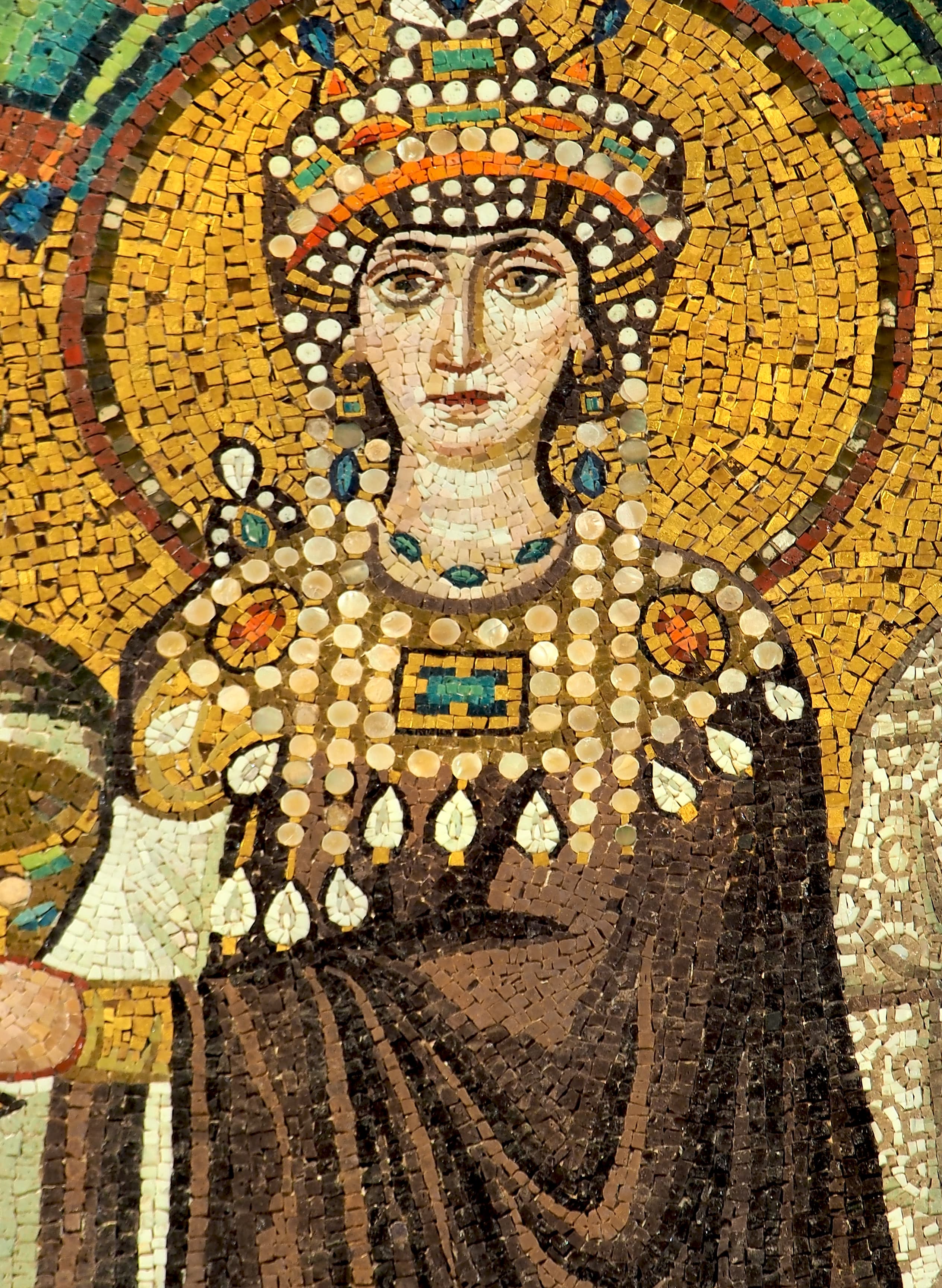 Empress Theodora bearing the golden chalice with her court in San Vitale