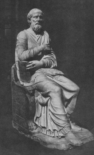 Statua antica di sant’Ippolito di Roma seduto sulla cattedra, con un libro in mano