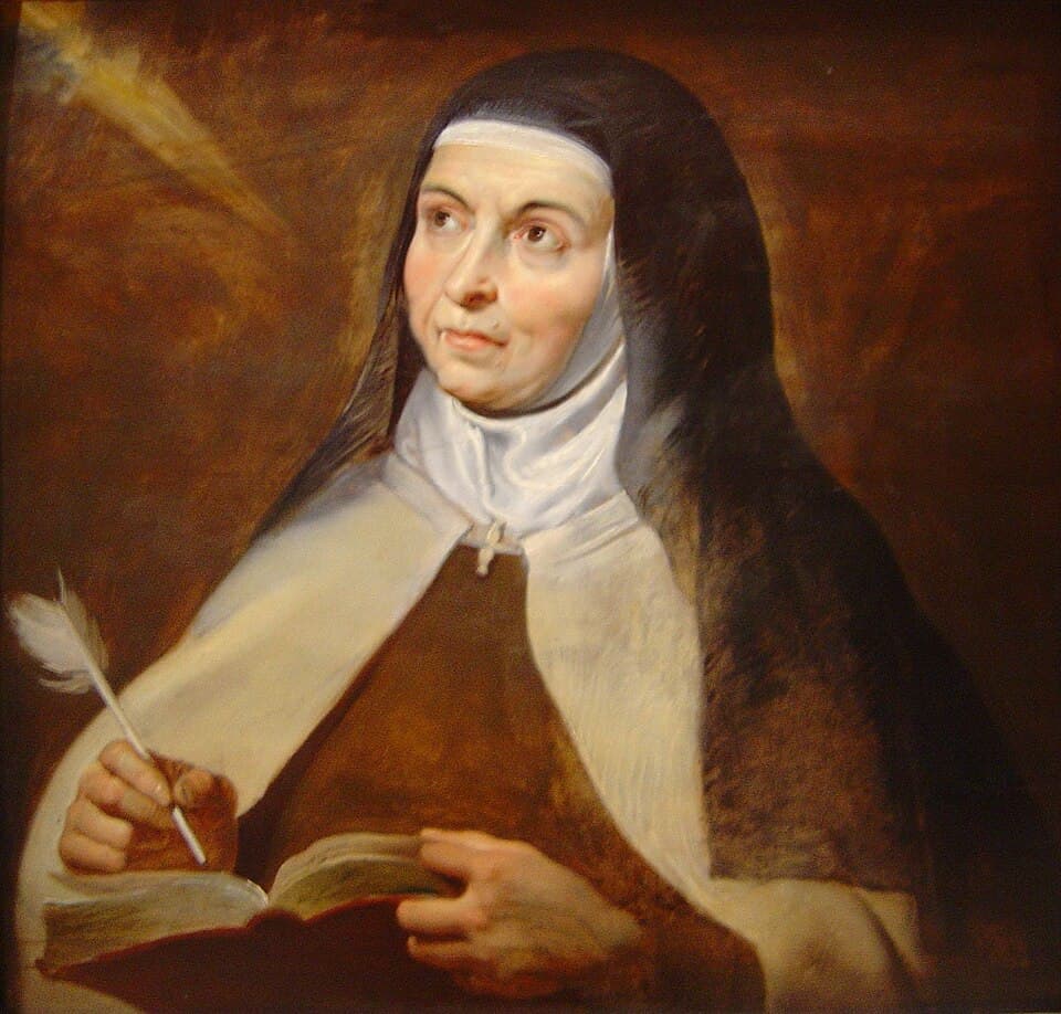 Saint Teresa of Avila holding a pen and a book