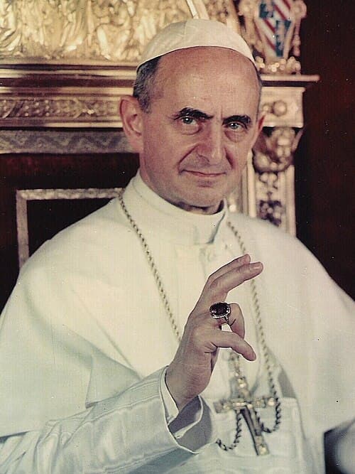 Paul VI around 1963, seated and giving his blessing