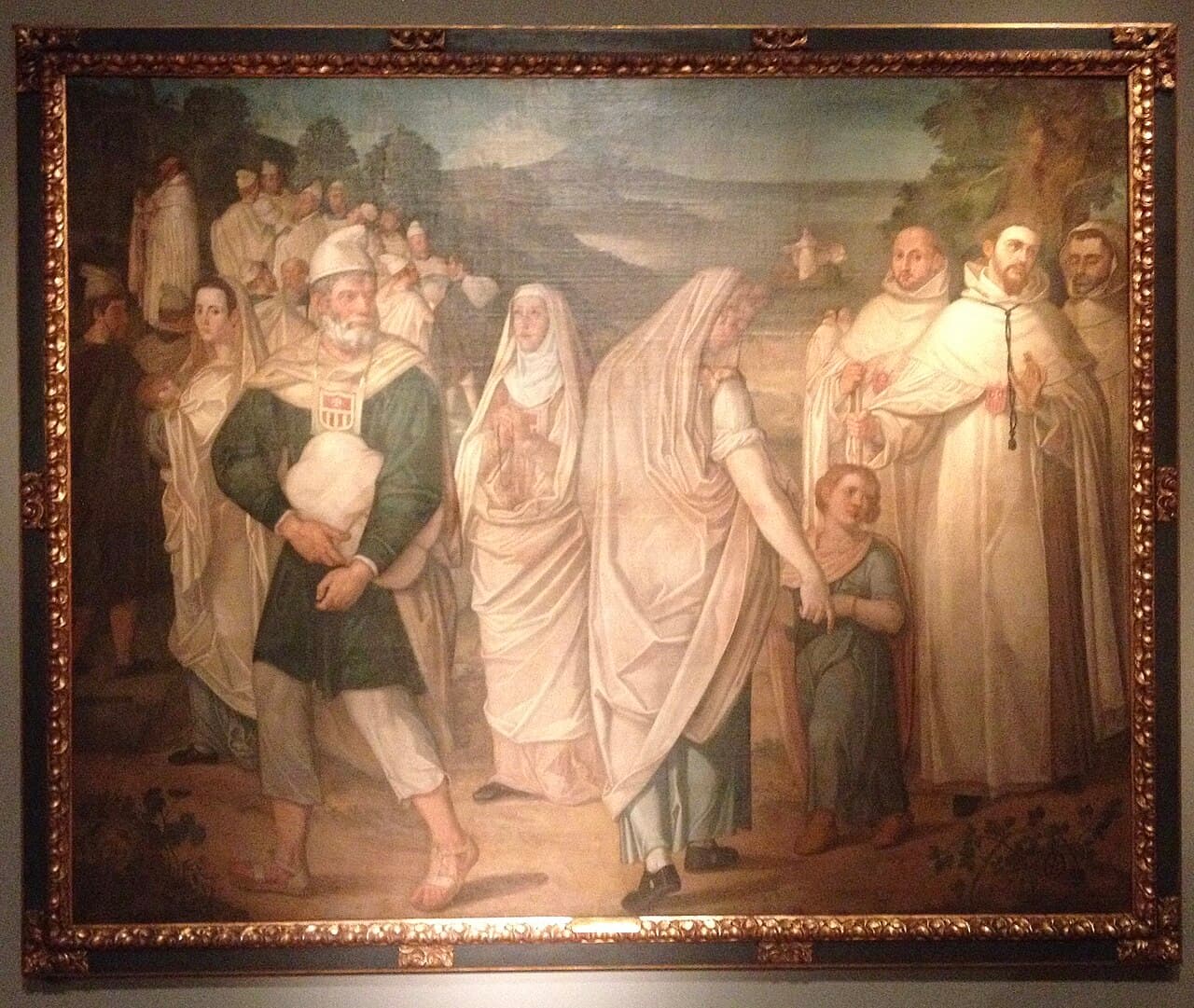 Mercedarians in white habits welcoming freed Christian captives as they disembark.
