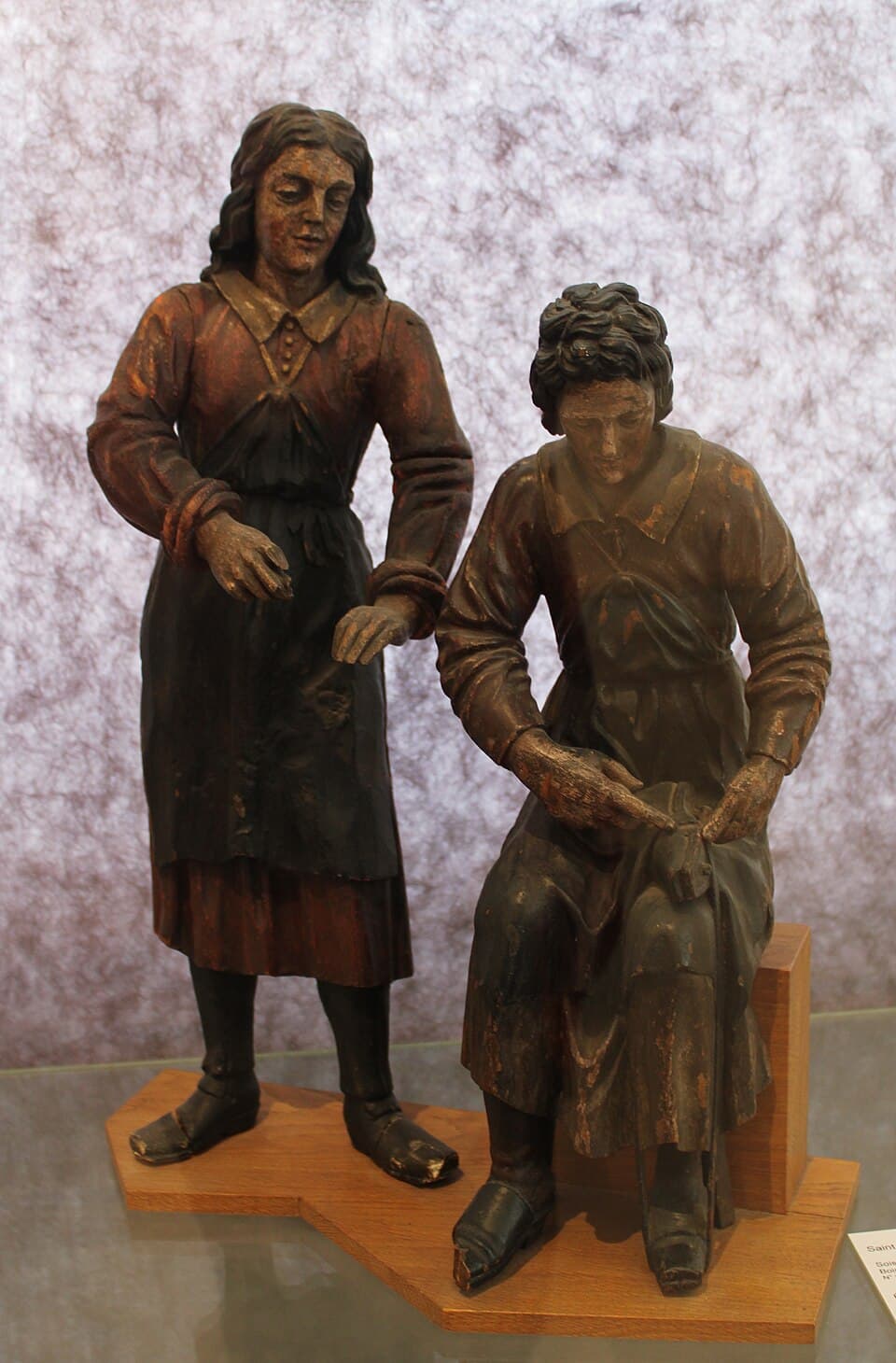 Polychrome wooden group of Saints Crispin and Crispinian in the museum of Soissons