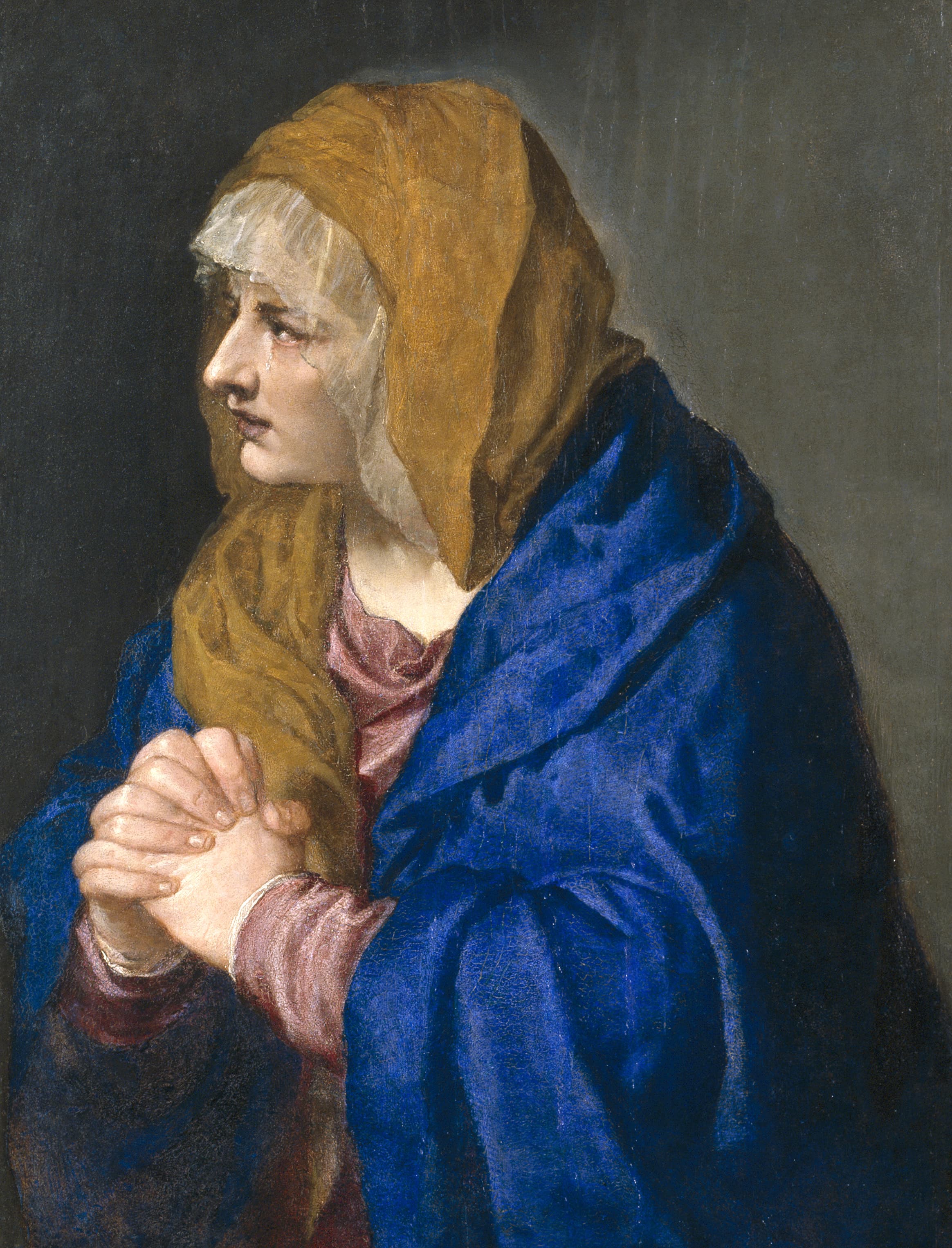 Die schmerzhafte Jungfrau mit gefalteten Händen, in einen blauen Mantel gekleidet, gemalt von Tizian.