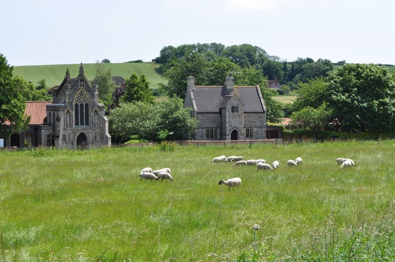 Slipper Chapel and presbytery seen from a meadow near Walsingham